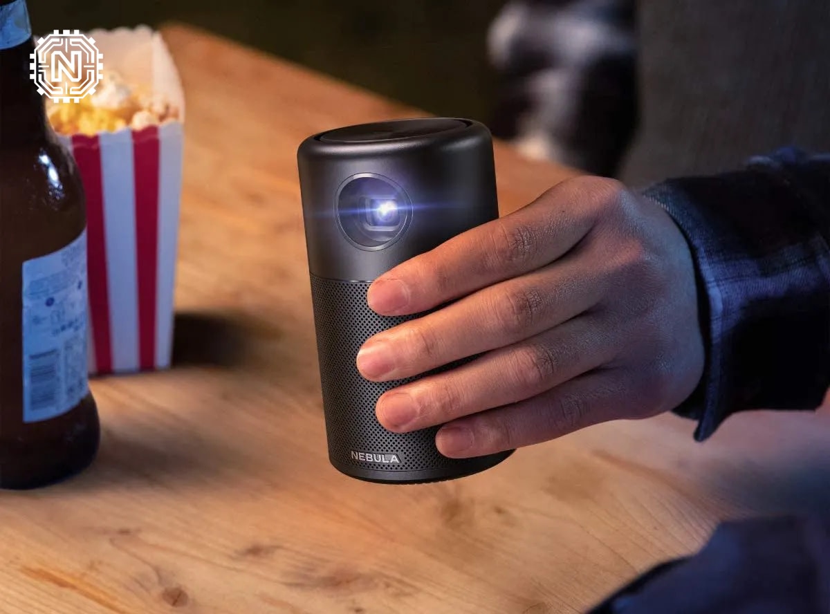 Family enjoying outdoor movie with a portable projector