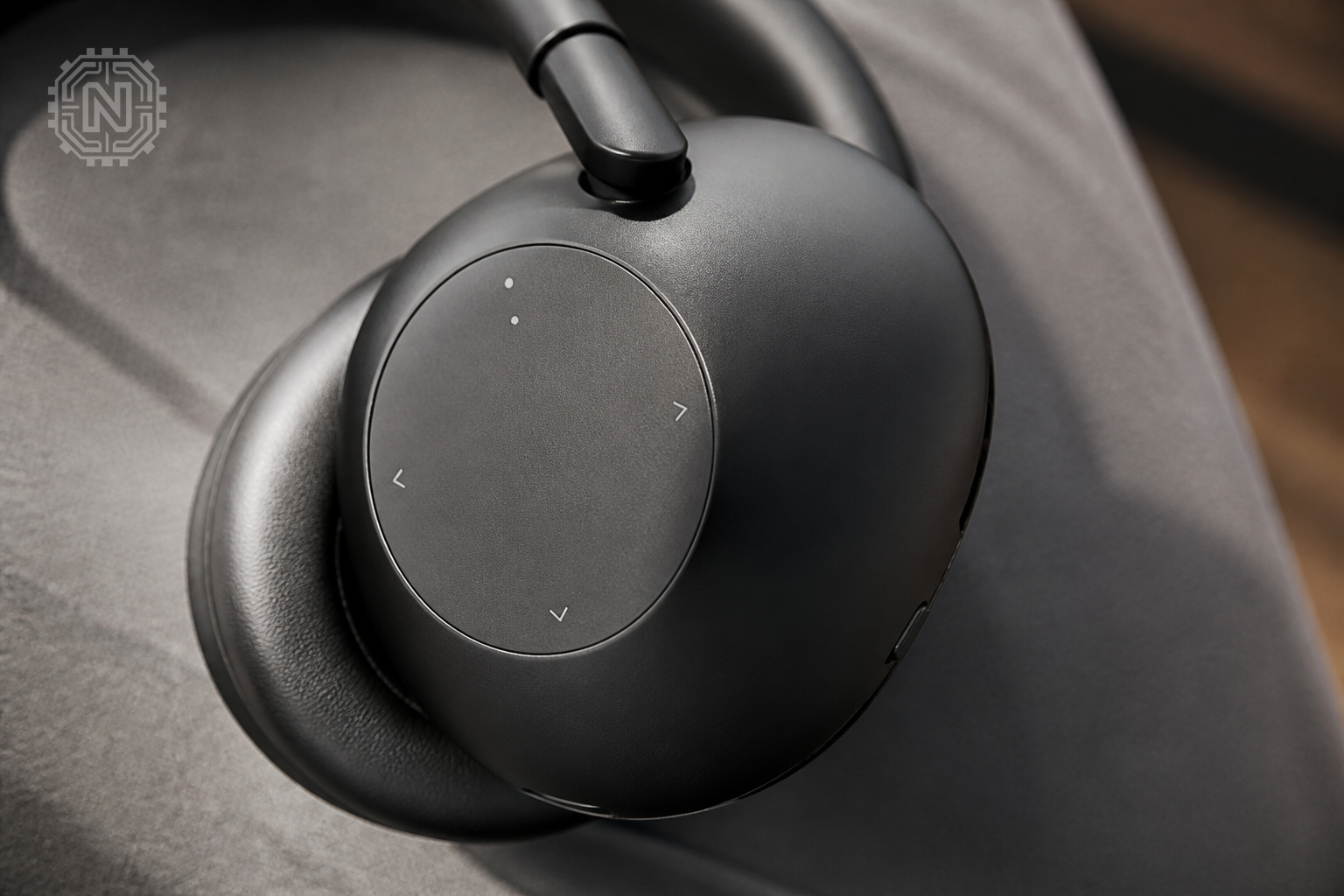 Close-up of Sony WH-1000XM6 control panel on earcup